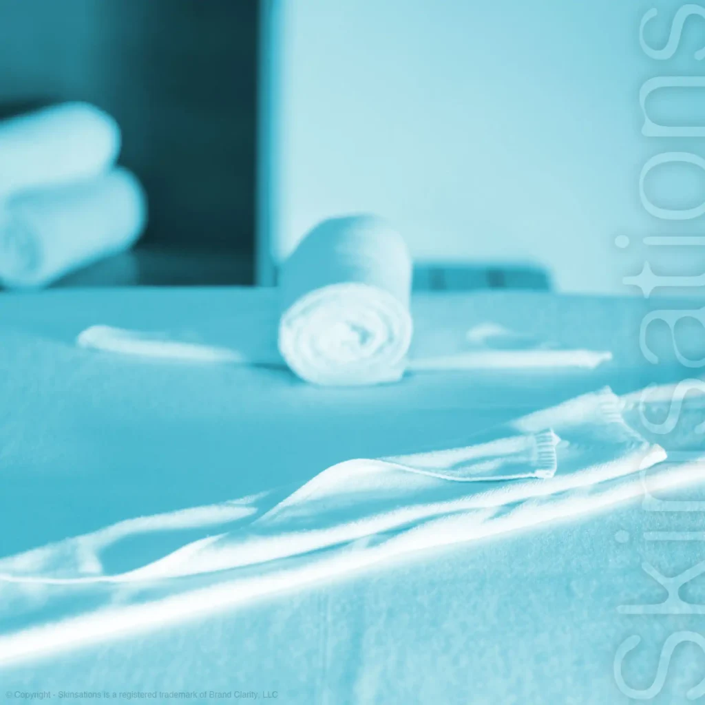 Professional massage table setup with towels used by massage therapists