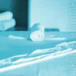 Professional massage table setup with towels used by massage therapists